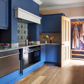 dark blue kitchen cabinets and wooden floor