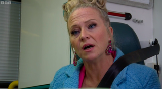 Linda looks worried in the ambulance with Janine