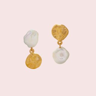 flat lay of gold and pearl earrings 