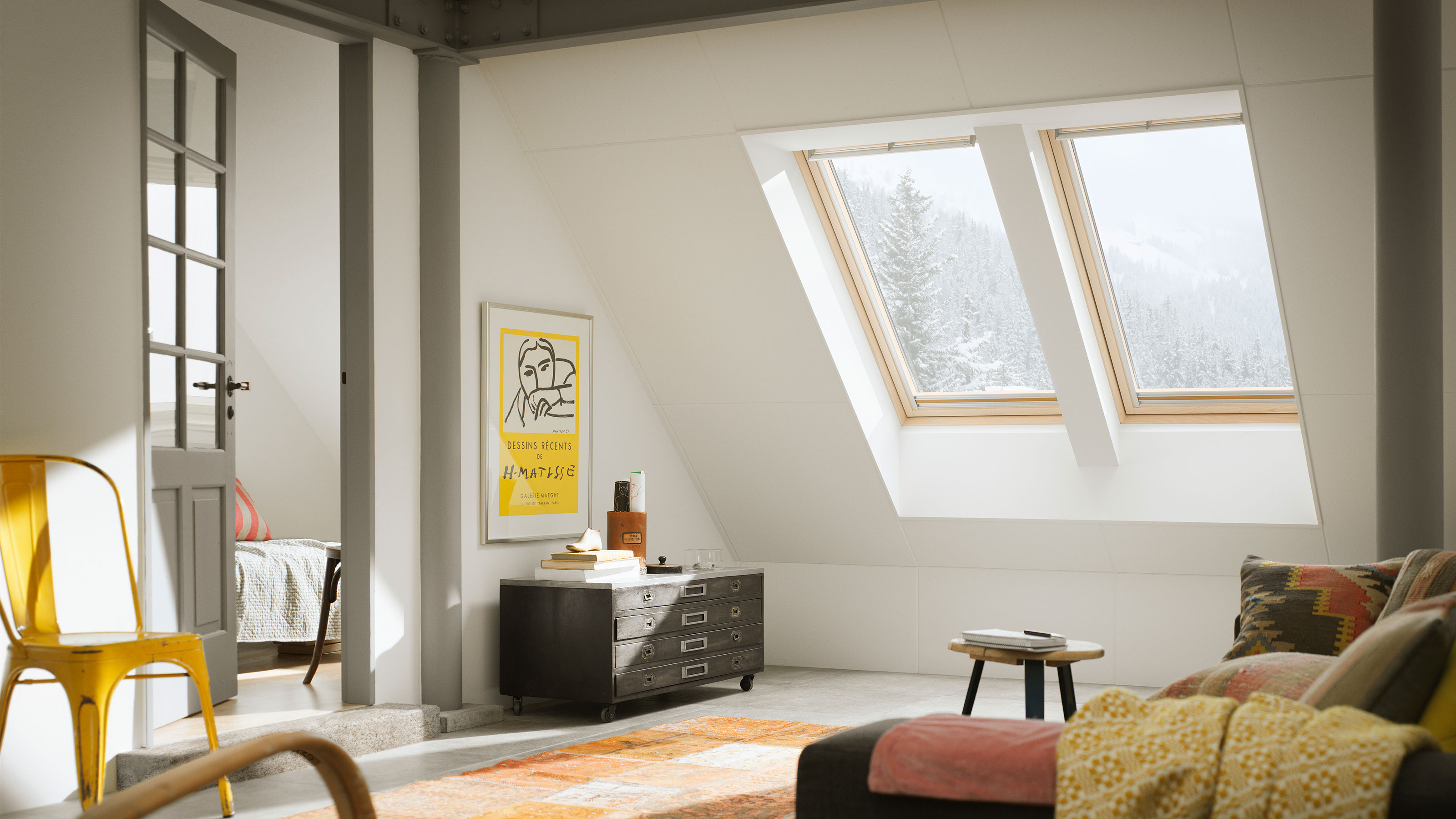 Eaves room in house with two roof windows