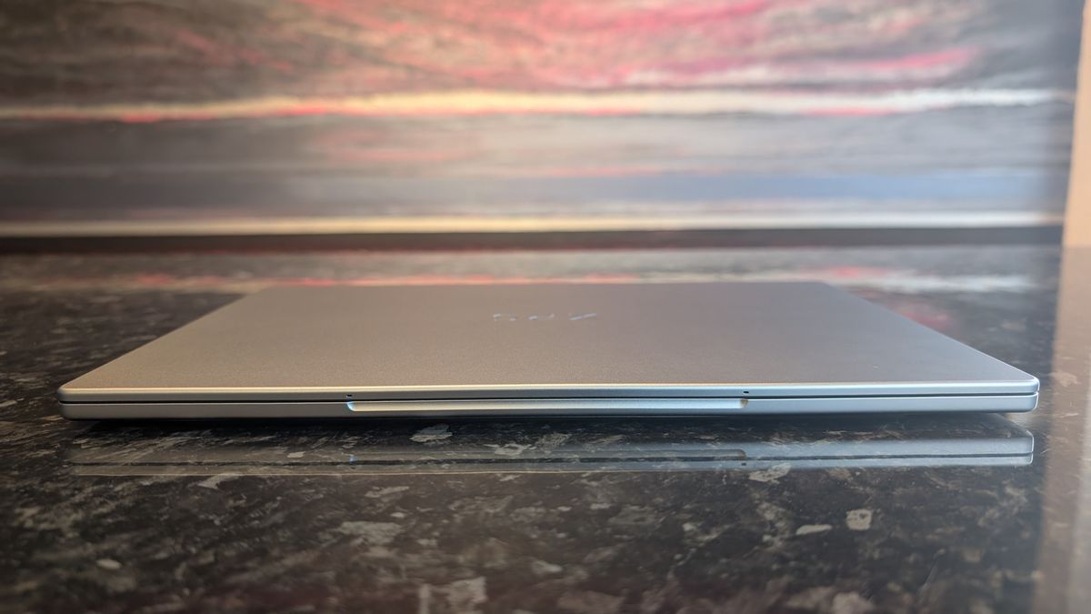 The Dell XPS 13 (2026) laptop pictured on a black marble worktop.