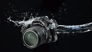 Pentax has claimed many of its DSLRs are weather-sealed rather than waterproof. In this case, it means they can withstand splashes of water but they cannot be used underwater.