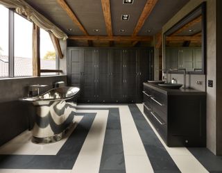 bathroom with honed cream and honed Belgian blue limestone flooring