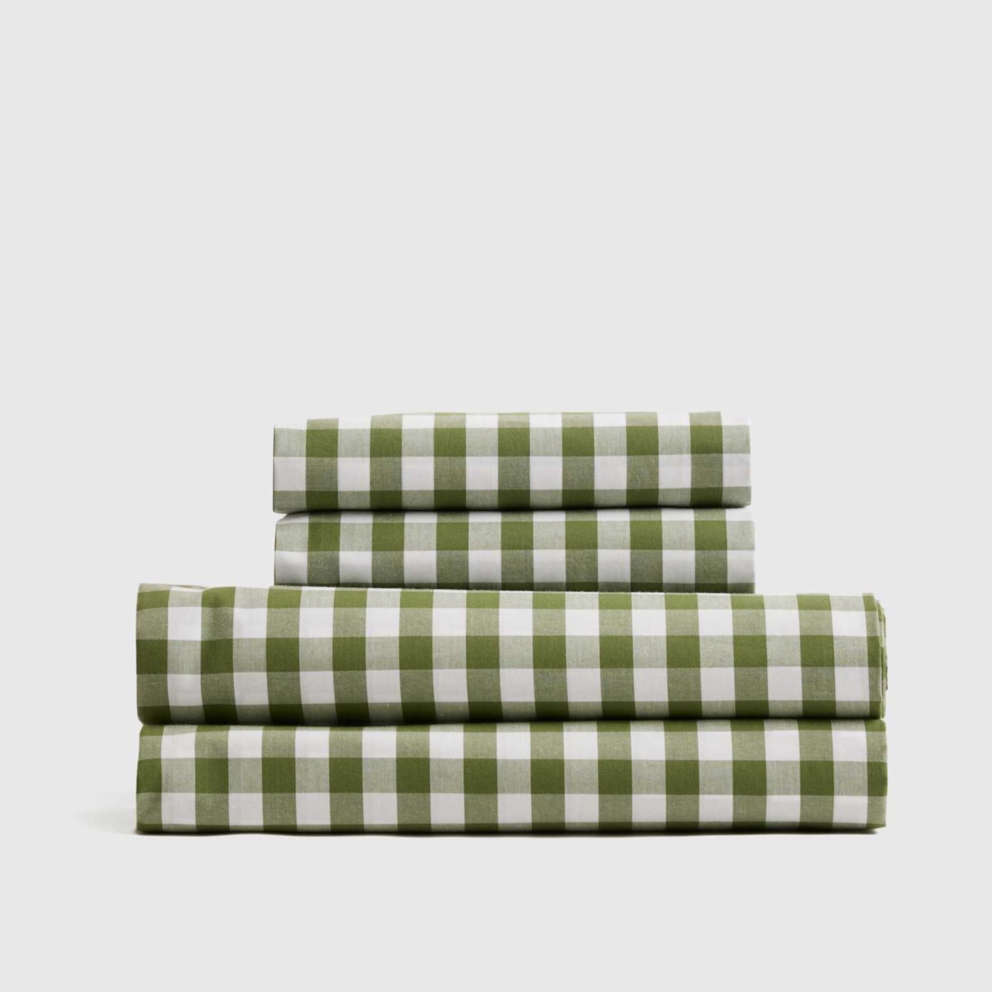 Green gingham Quince percale sheet set folded and stacked