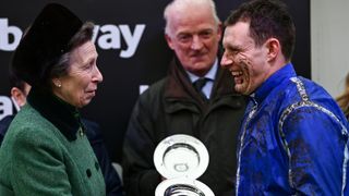 Princess Anne, Princess Royal, presents the jockeys winning plate to Paul Townend after winning the Betway Queen Mother Champion Chase