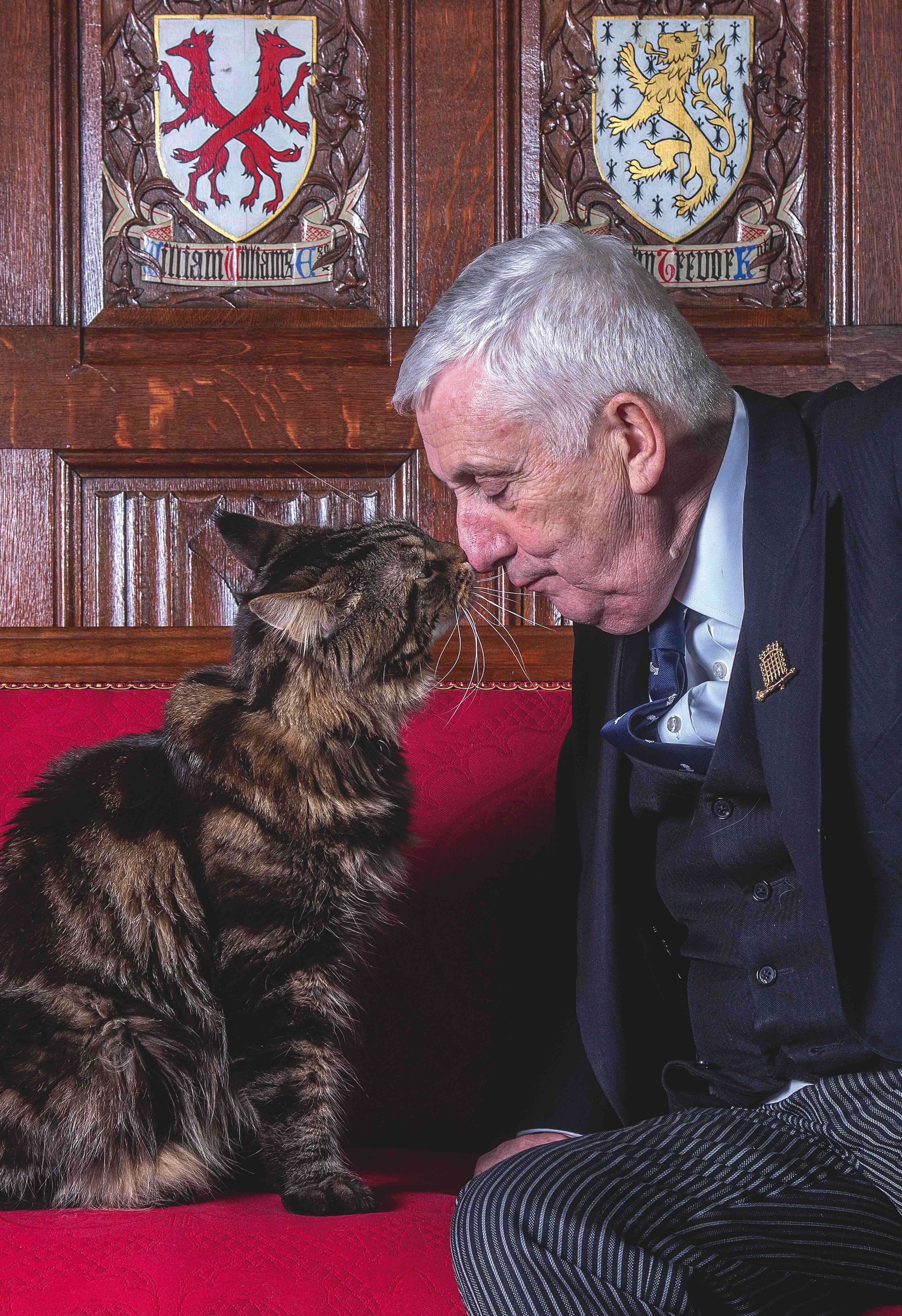 Sir Lindsay Hoyle, Speaker of the House of Commons, with his cat Attlee in the Crimson Drawing Room in the Speakers House at the Houses of Parliament in London. Photo: Mark Williamson