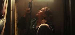 Millicent Simmonds as Regan with a gun in Quiet Place Part II