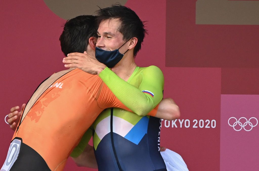 Gold medalist Slovenias Primoz Roglic R is congratulated by Netherlands Tom Dumoulin after the mens cycling road individual time trial during the Tokyo 2020 Olympic Games at the Fuji International Speedway in Oyama Japan on July 28 2021 Photo by Greg Baker AFP Photo by GREG BAKERAFP via Getty Images