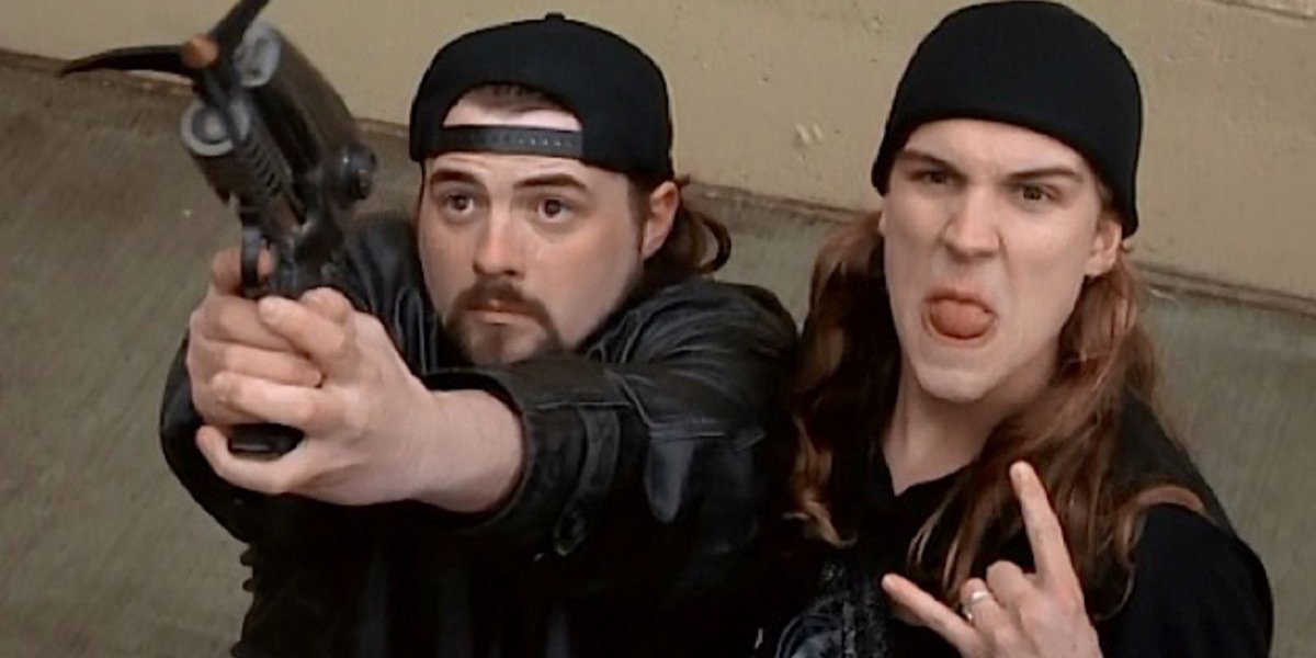 Mallrats Silent Bob raises a grappling gun, as Jay gets rude