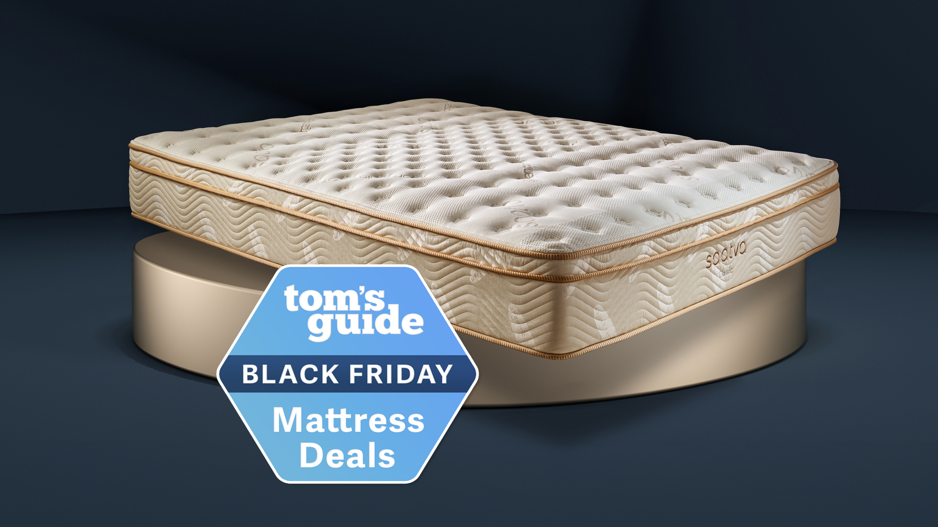 The Saatva Classic mattress shown on a gold plinth, with a blue Tom's Guide Saatva Black Friday sale badge overlaid on the bottom of the mattress