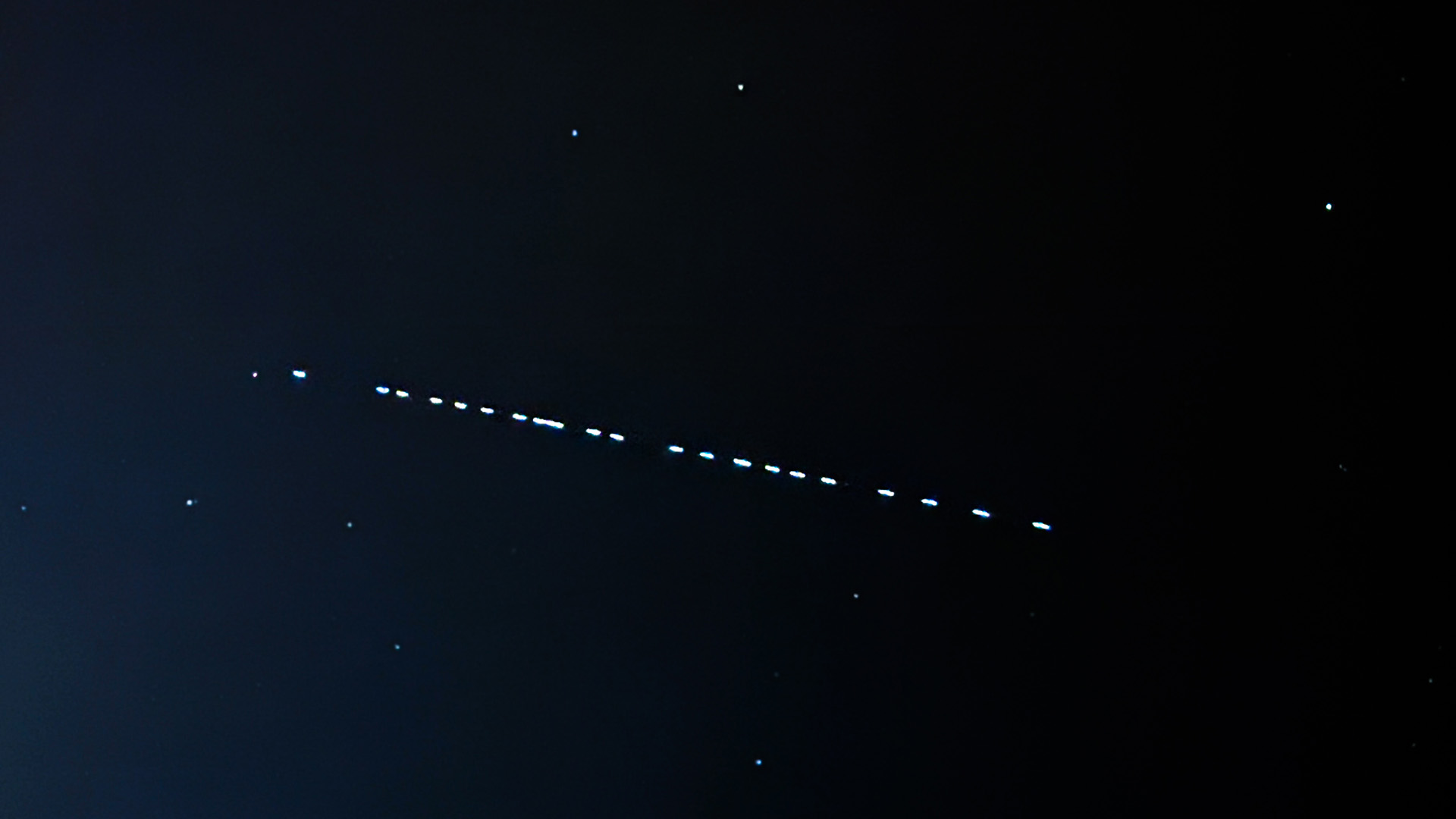 Starlink satellites passage is seen on the sky in southern Poland on November 1, 2024.