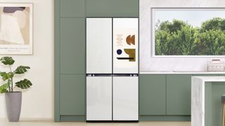 samsung bespoke smart refrigerator in white on a green background