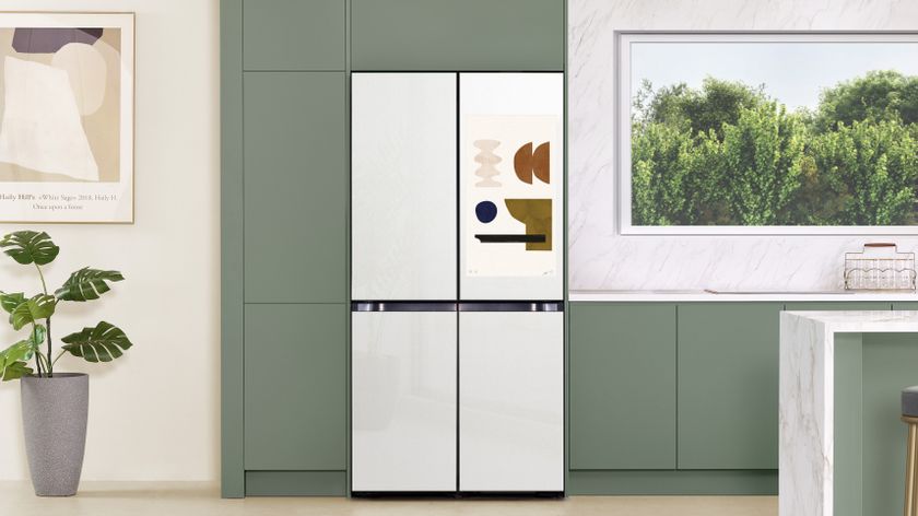 samsung bespoke smart refrigerator in white on a green background