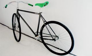 Black bicycle with green seat
