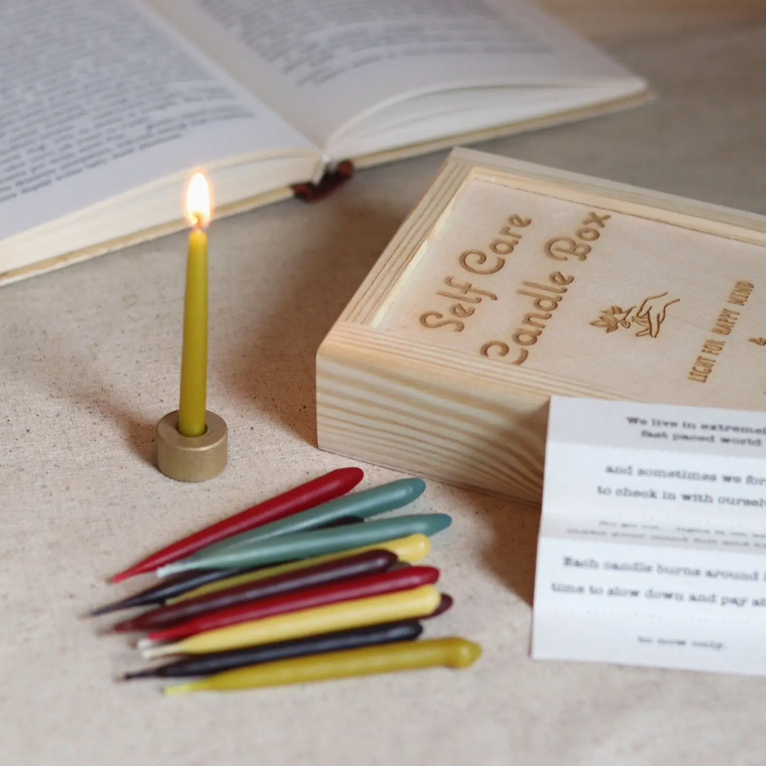 A mini meditation candle on a holder