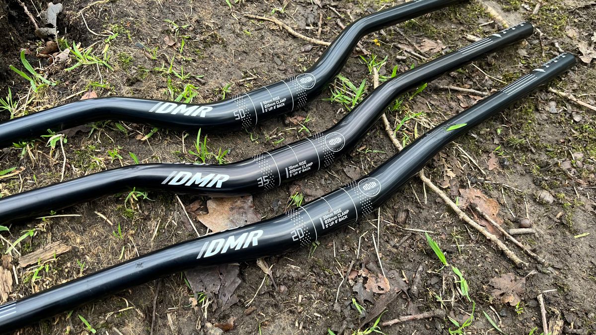 Three sets of MTB handlebars with different rises