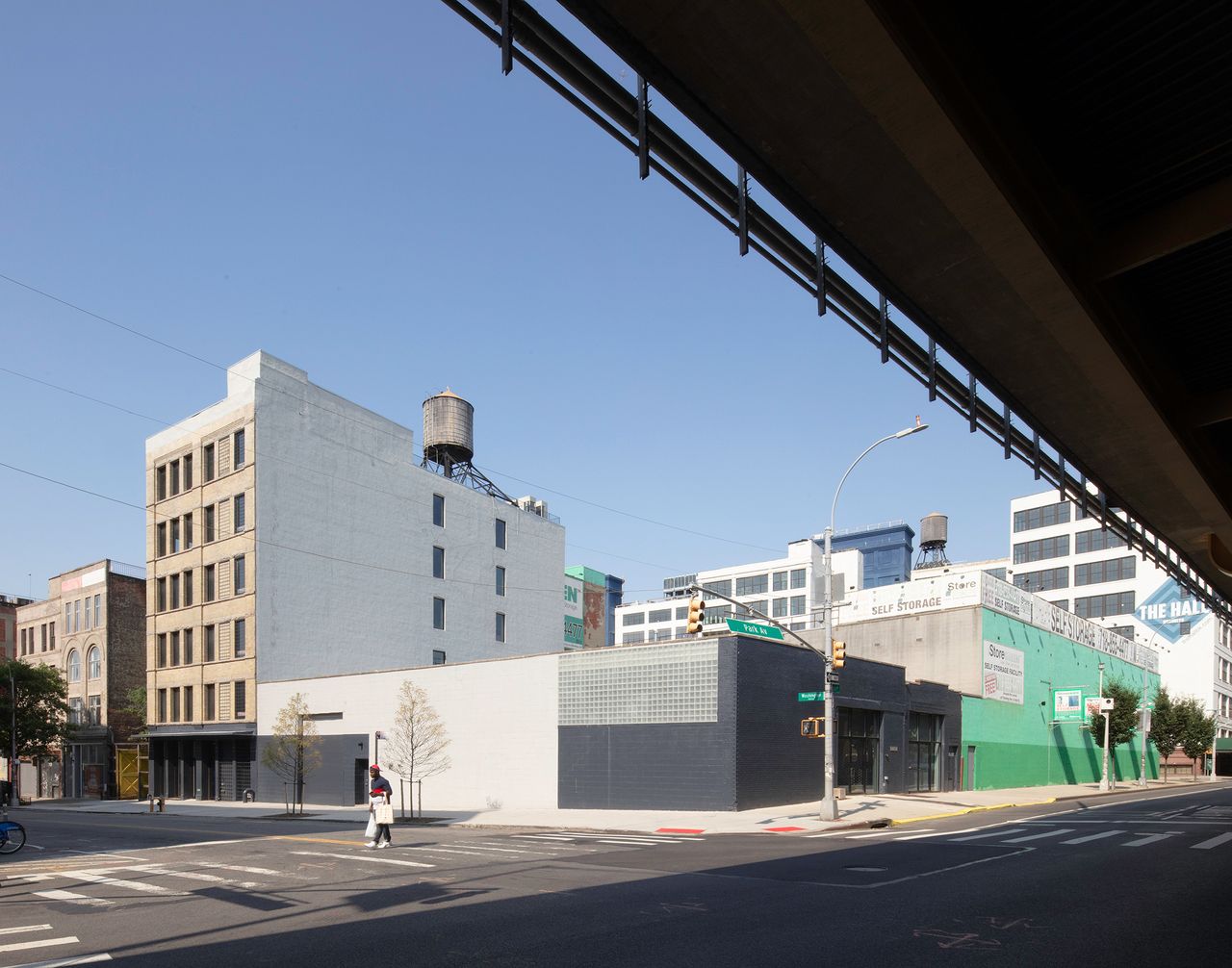 Outside street view of grey and black warehouse