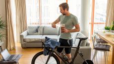 Image shows cyclist wearing headphones