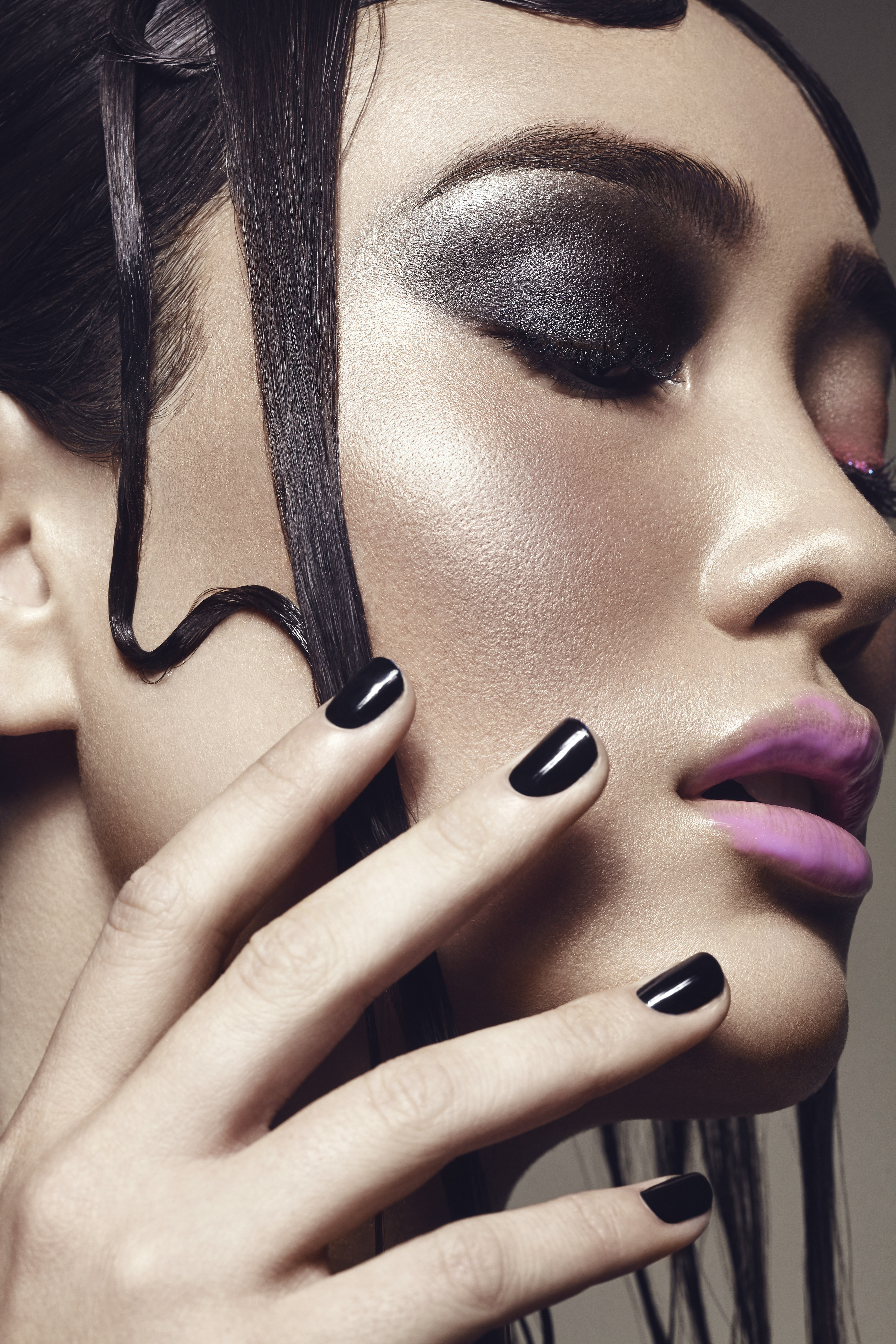 Black nails and eyeshadow on model