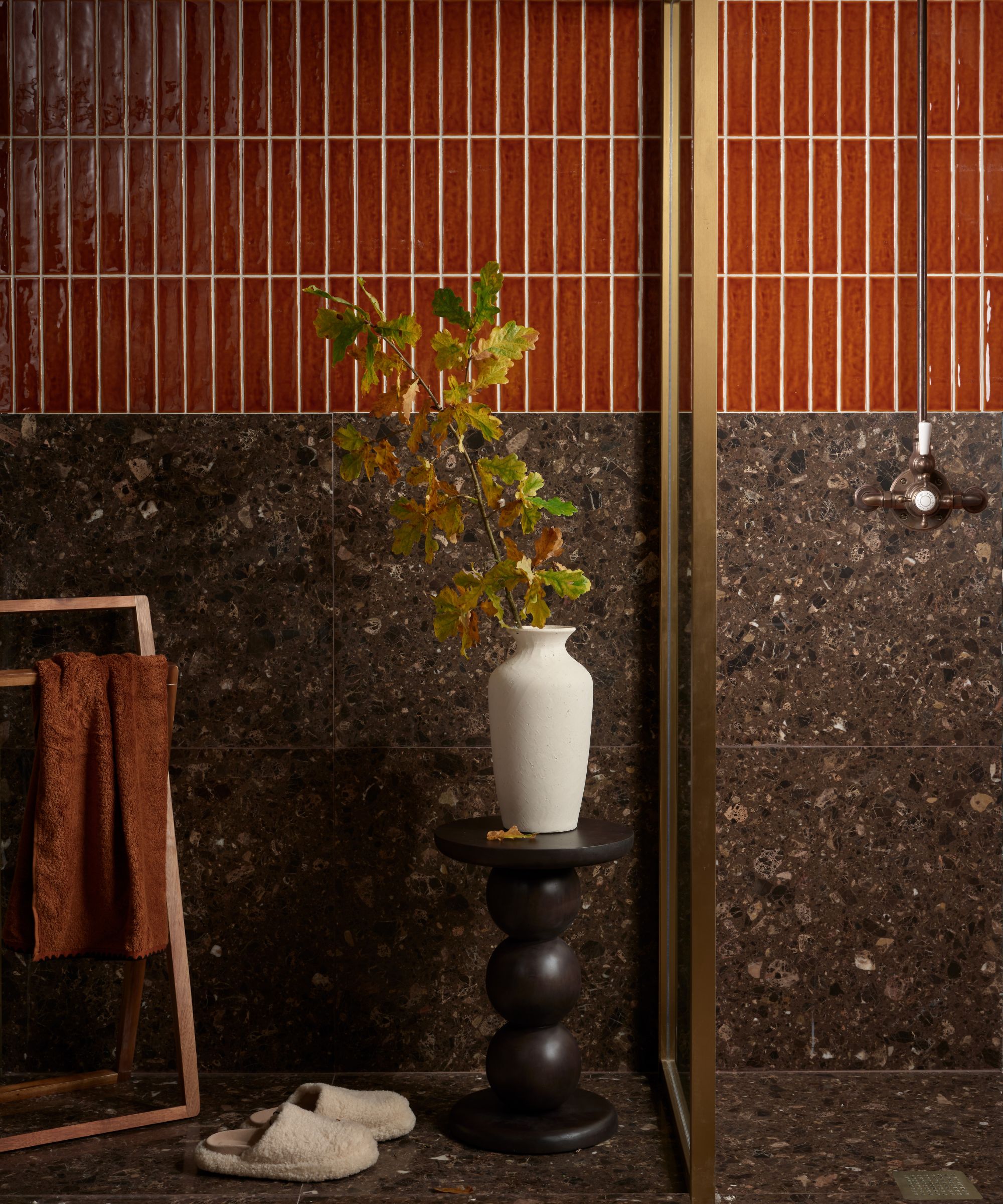 brown tiled shower with terazzo