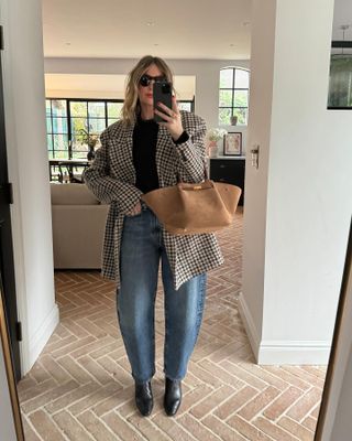 Emma carries a suede DeMellier bag
