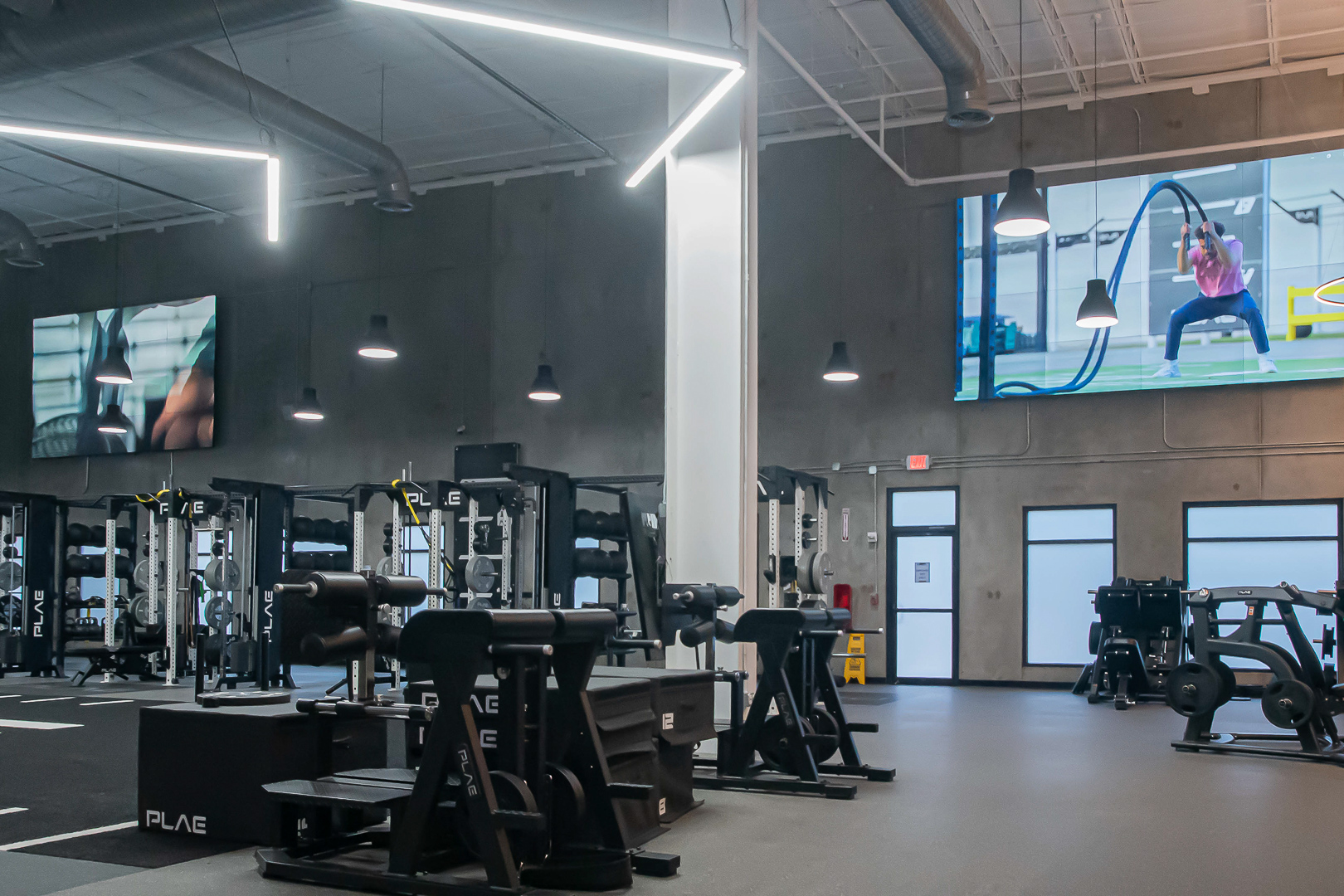 FITNESS2020 gyms are donned with displays of instructors leading workouts.