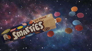 U.K. confectionary Smarties against a background of stars