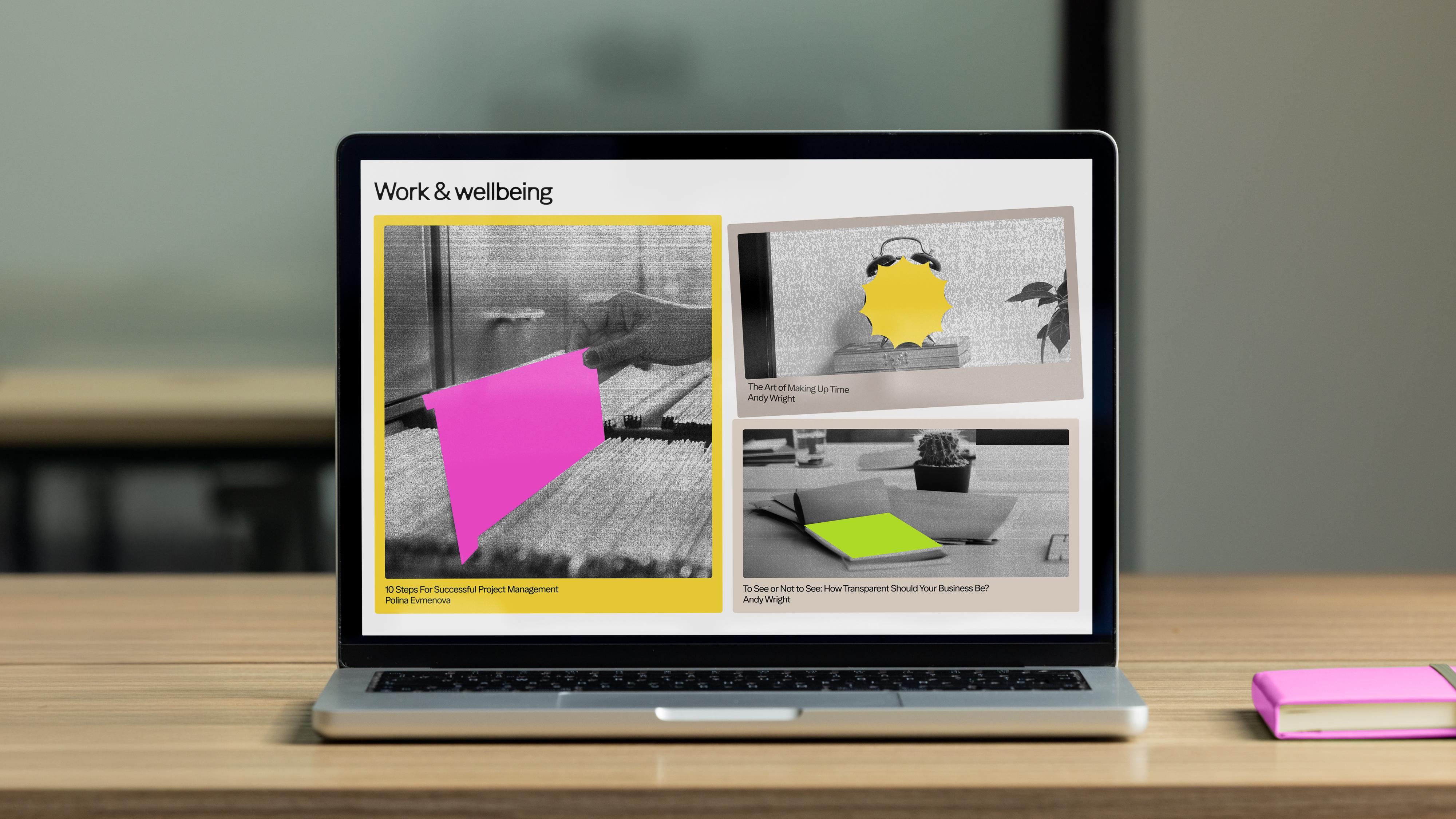 a laptop with a website open on it that says work and wellbeing