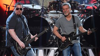 Wolfgang Van Halen (L) and Eddie Van Halen of Van Halen perform during the 2015 Billboard Music Awards at MGM Grand Garden Arena on May 17, 2015 in Las Vegas, Nevada.