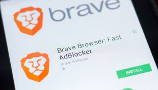 A close-up of the Brave browser listing in the Google Play app store displayed on an Android smartphone.