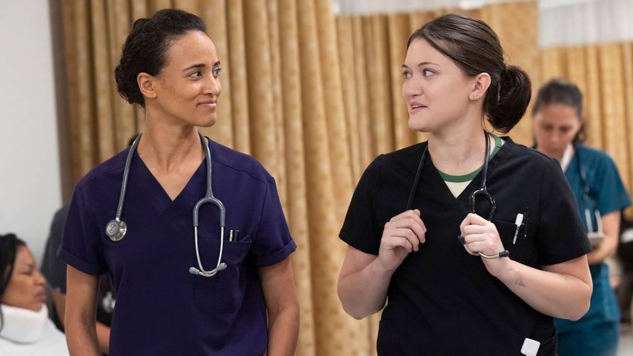 From left to right: Alexandra Metz and Isa Briones looking at each other in Season 1 of The Pitt. 