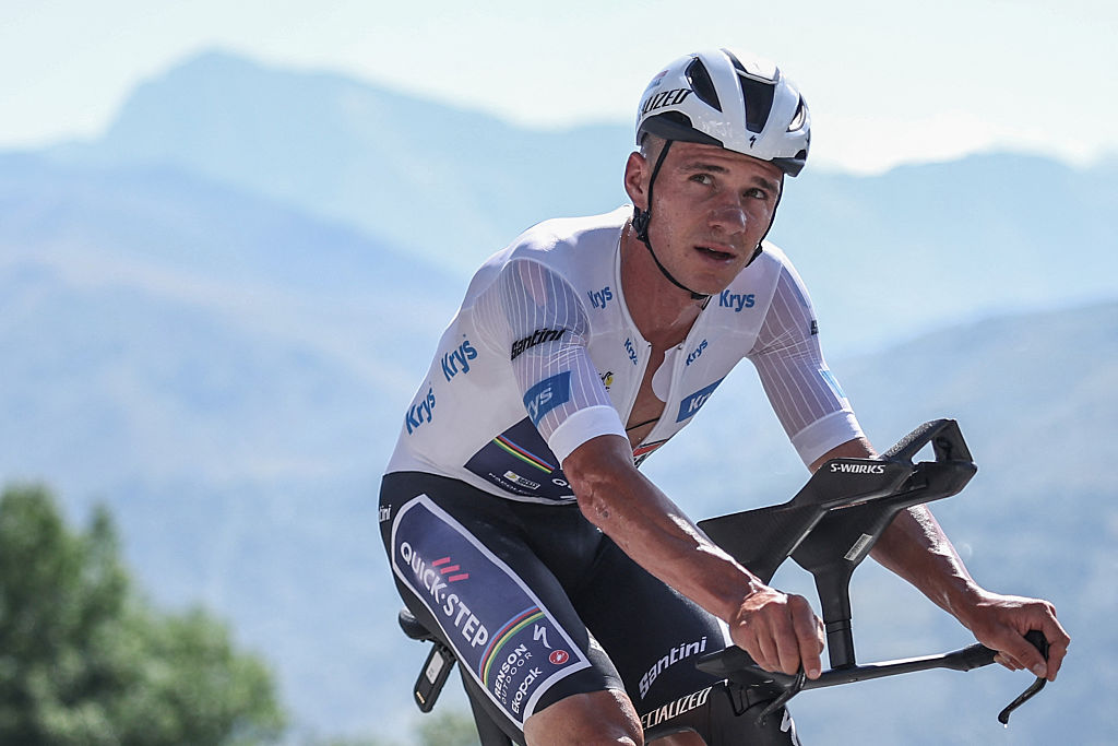 Soudal Quick-Step team&#039;s Belgian rider Remco Evenepoel wearing the best young rider&#039;s white jersey cycles during the 13th stage of the 112th edition of the Tour de France cycling race, 10.9 km individual time trial between Loudenvielle and Peyragudes, in the Pyrenees mountains of southwestern France, on July 18, 2025. (Photo by Anne-Christine POUJOULAT / AFP)
