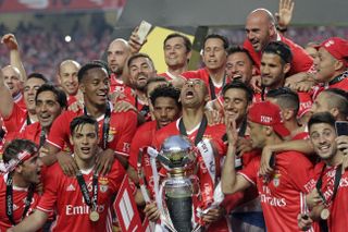 Benfica players celebrate in May 2017 after winning a fourth consecutive Portuguese title.