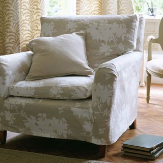 cushion on armchair with books