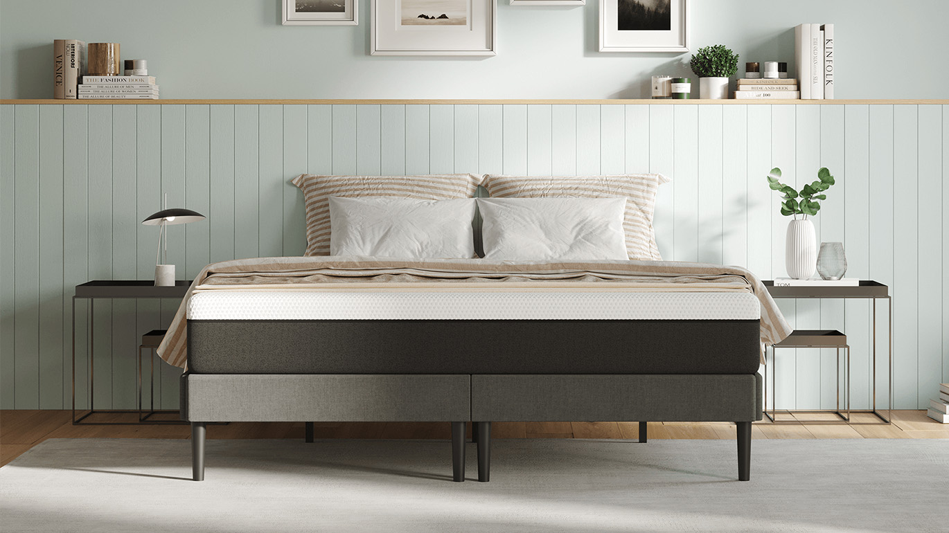 The Emma Mattress, pictured on a grey bed frame, is 50% off in the Boxing Day mattress sales