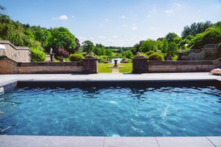Swimming pool at The Tawny Hotel surrounded by formal walled garden