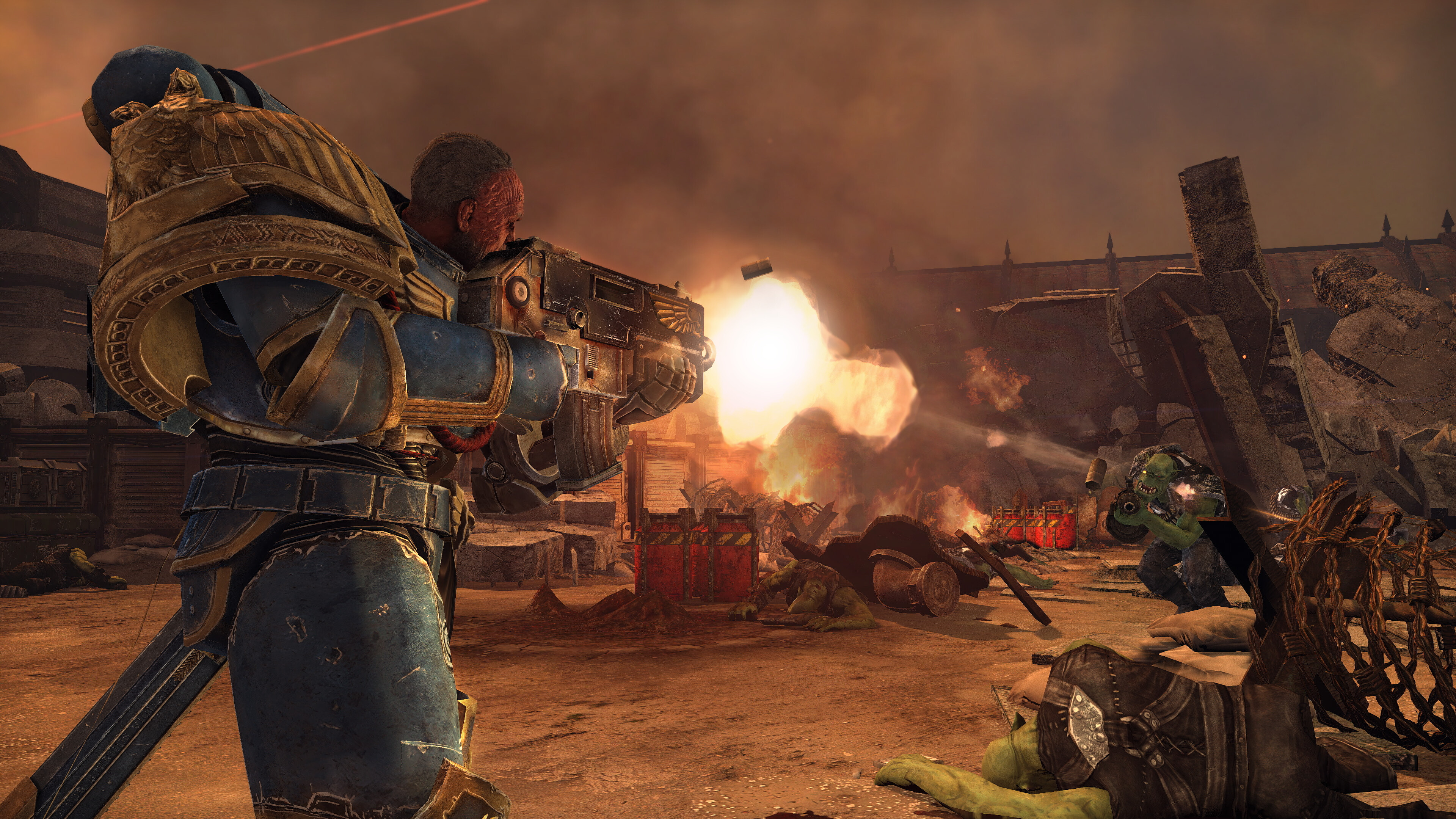 Promotional screenshot of a Space Marine battling Orks in Warhammer 40,000: Space Marine Master Crafted Edition