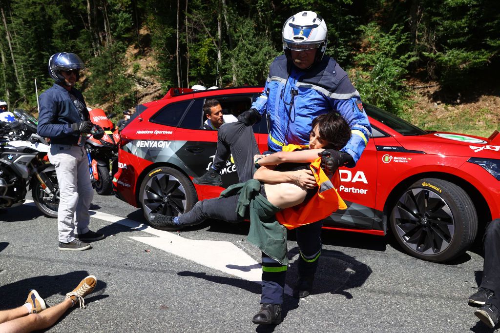 MEGEVE FRANCE JULY 12 Protesters in defending Mont Blanc environment block the route during the 109th Tour de France 2022 Stage 10 a 1481km stage from Morzine to Megve 1435m TDF2022 WorldTour on July 12 2022 in Megeve France Photo by Michael SteeleGetty Images