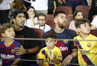 Lionel Messi and Luis Suarez were keen spectators in the stands