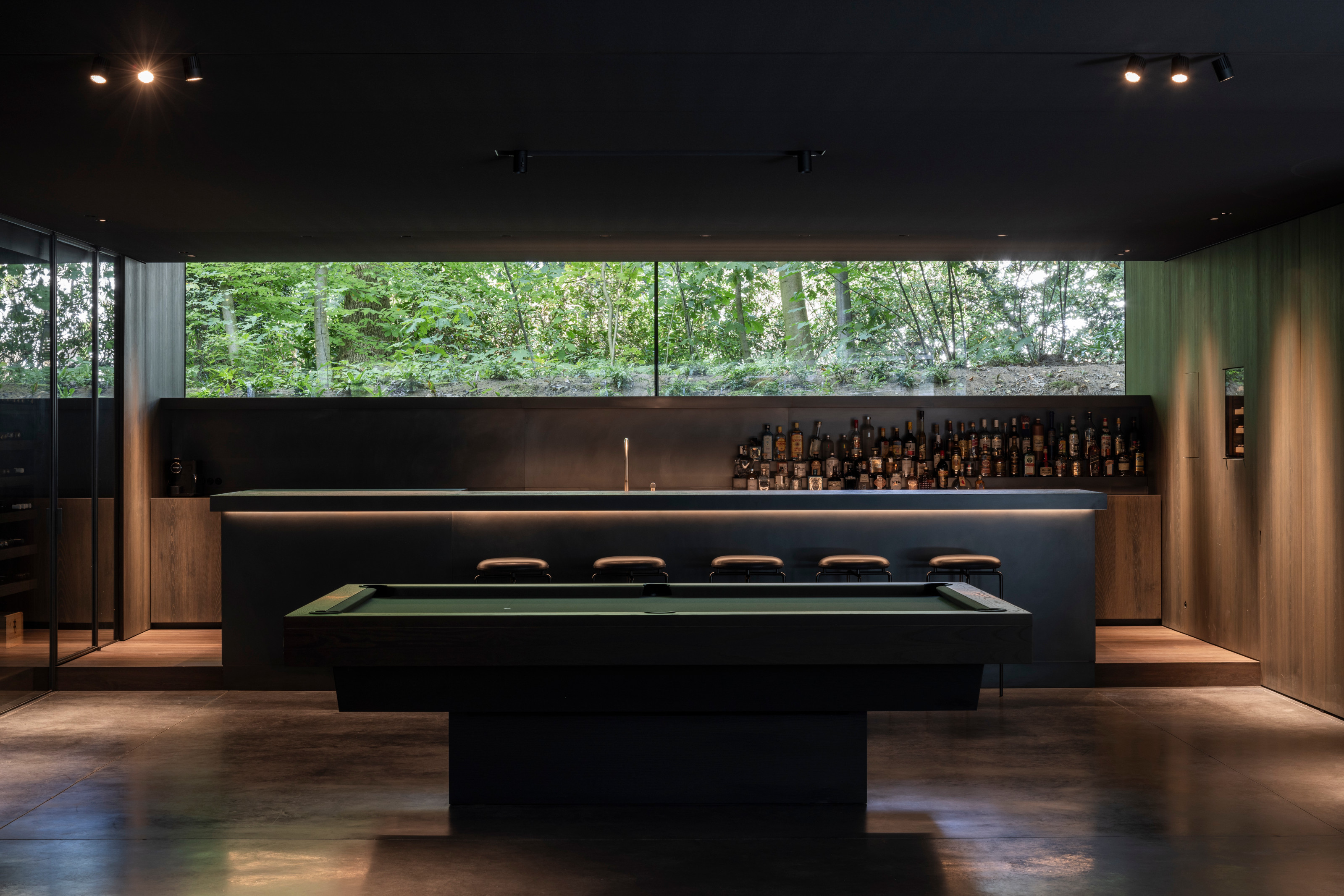 Down here there's also a bar and pool table