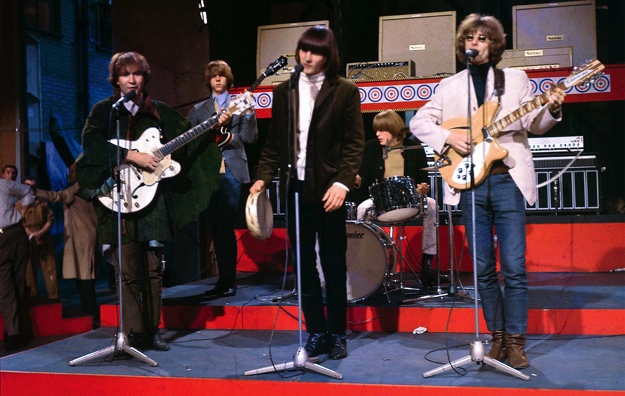 The Byrds performing at Wembley Studios, London, August 1965. L-R David Crosby, Chris Hillman (back), Gene Clark, Michael Clarke, Roger McGuinn (playing Rickenbacker 370/12 guitar)