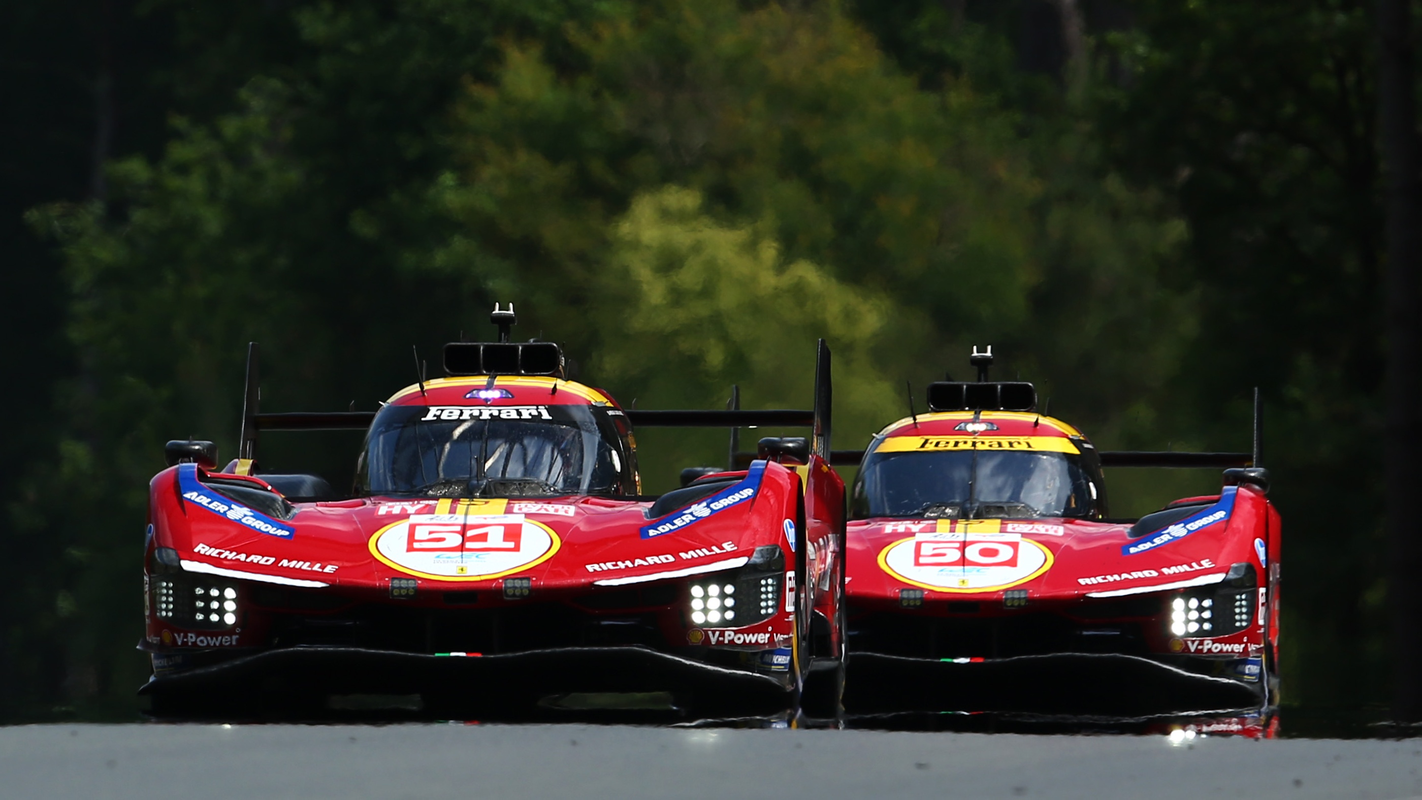 The #51 AF Corse Ferrari 499P of James Calado, Alessandro Pier Guidi, and Antonio Giovinazzi drives ahead of its sister car the #50 Ferrari AF Corse, Ferrari 499P of Antonio Fuoco, Miguel Molina, and Nicklas Nielsen during practice for the 24 Hours of Le Mans at the Circuit de la Sarthe