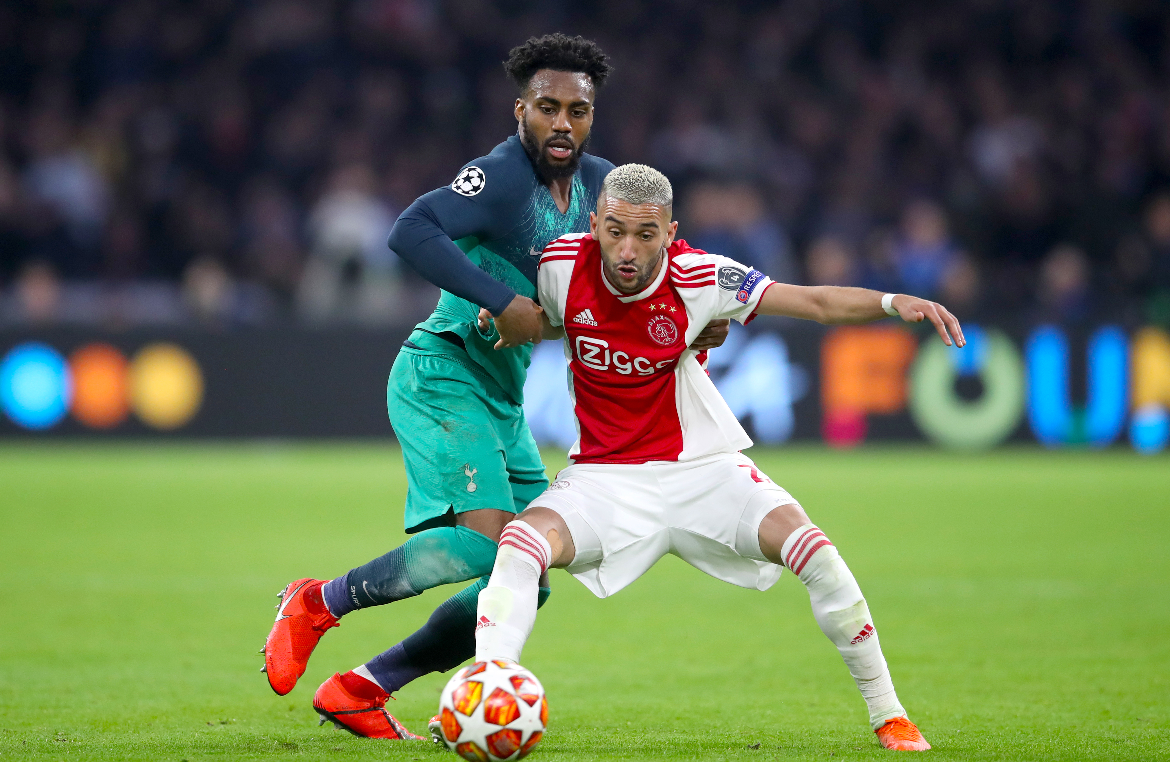 Hakim Ziyech competes with Tottenham's Danny Rose in the Champions League last season
