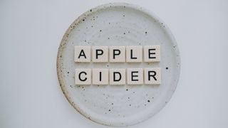 how to lose weight: : tiles spelling "apple cider" on a plate