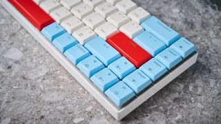 A Cherry MX LP 2.1 low-profile keyboard with red, white and blue keycaps