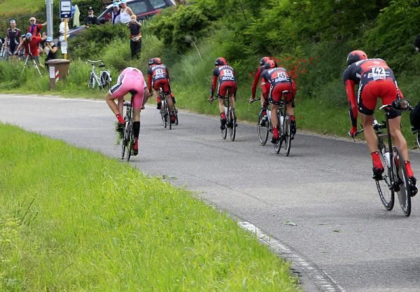 Taylor Phinney (BMC) narrowly avoids crashing after going off the road, and then has to pick the grass out of his drivetrain.