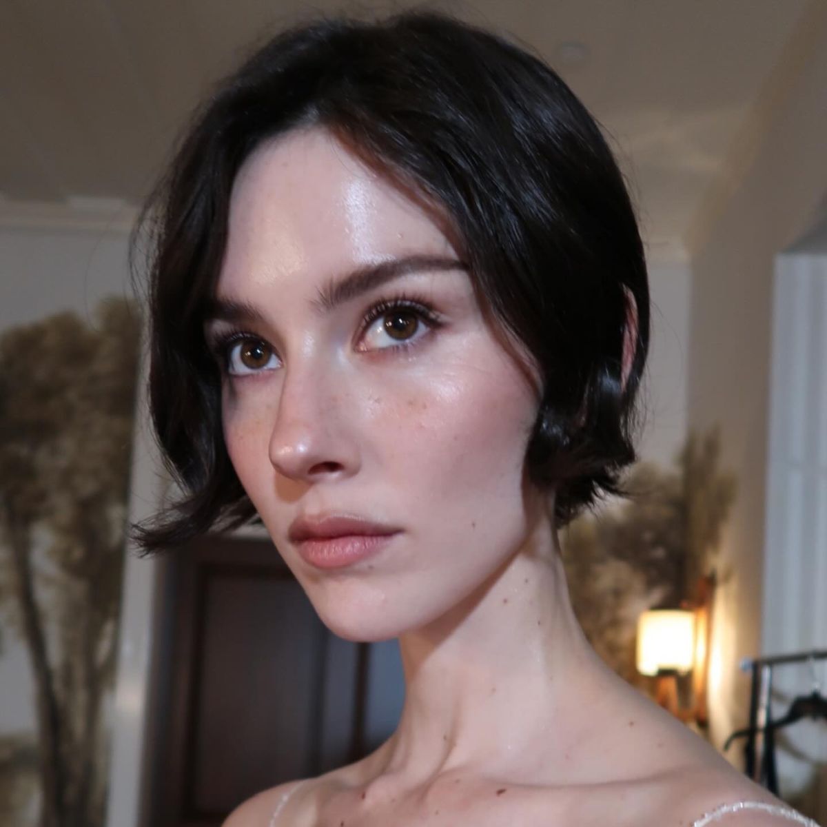 Gracie Abrams wearing a glowing makeup look