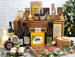 Christmas hamper with meats, pies, wine and cheese