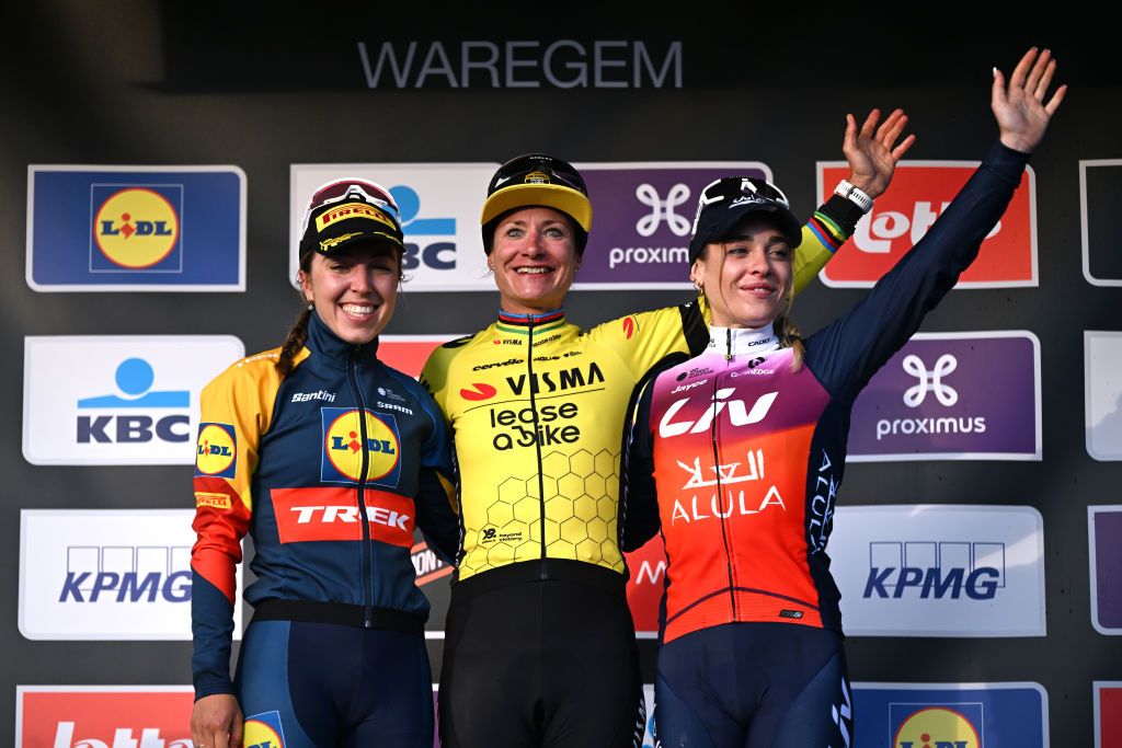 WAREGEM BELGIUM MARCH 27 LR Shirin van Anrooij of The Netherlands and Team Lidl Trek on second place race winner Marianne Vos of The Netherlands and Team VismaLease a Bike and Letizia Paternoster of Italy and Team LivAlUla Jayco on third place pose on the podium ceremony after the 12nd Dwars door Vlaanderen 2024 Womens Elite a 1299km one day race from Waregem to Waregem on March 27 2024 in Waregem Belgium Photo by Tim de WaeleGetty Images