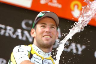 Mark Cavendish uncorks the bubbly after his third stage win
